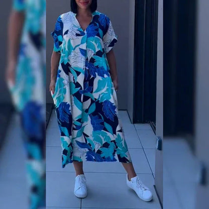 Elena™ | Blommig och elegant klänning med svepande siluett